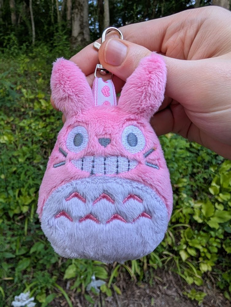 A handmade pink Totoro plushie keychain from the Studio Ghibli movie My Neighbor Totoro.