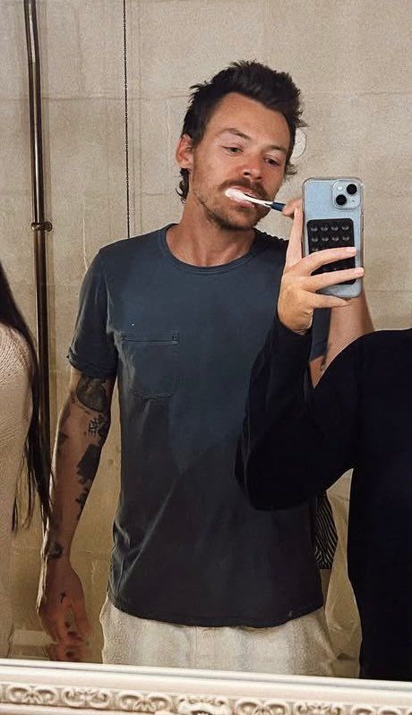 Harry Styles brushing his teeth