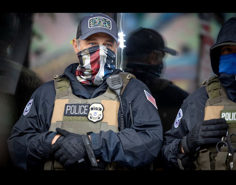 Ice agent wearing a face covering 