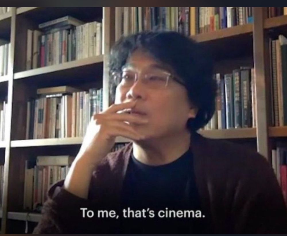 Bong Joonho with his fingers on his mouth saying “to me, that’s cinema”
