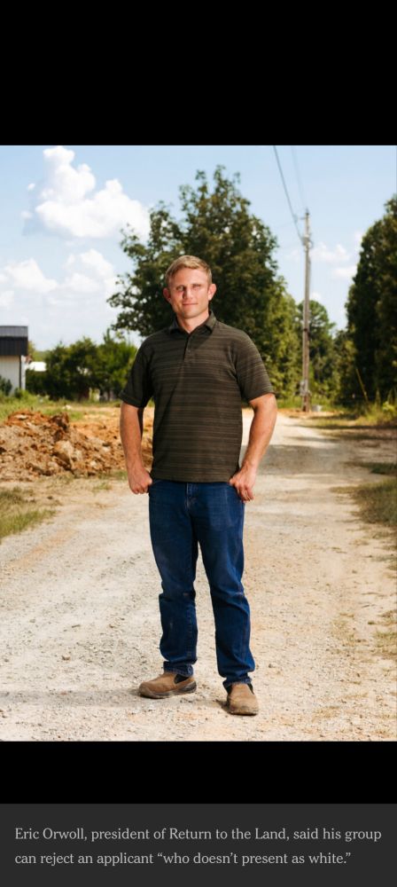 A white guy named Eric Orwall wearing jeans and a polo stands on a dirt road.  Looks like possibly the first time he's dressed himself, def bought those clothes yesterday. Thumbs rest awkwardly in his pockets. Massive tool vibes. 