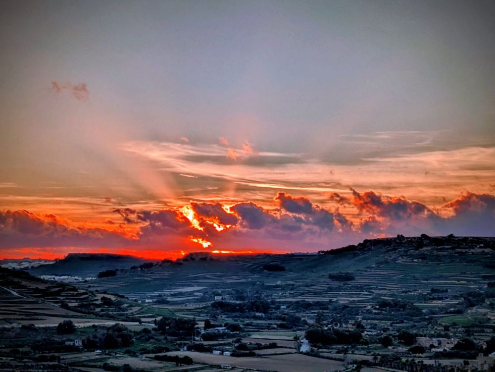 Glorious red sunset over Ramla valley as the valley darkens
