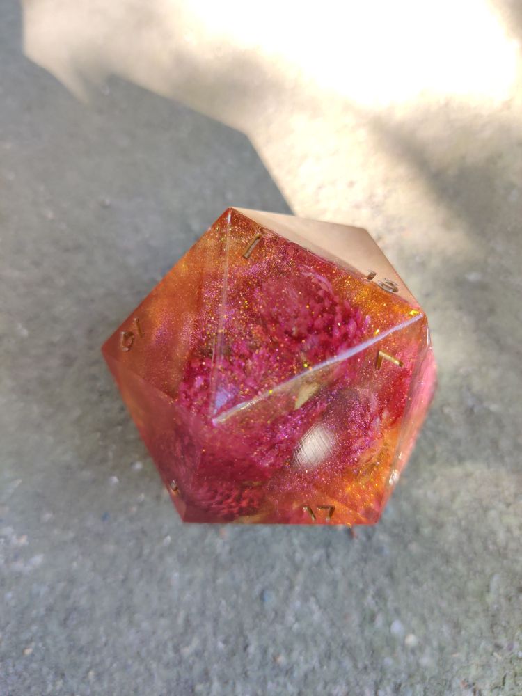 the 1 face pointing up, showing the distribution of the various micas and glitters inside