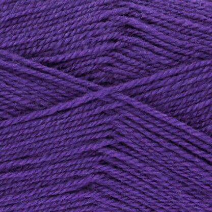 A close up of purple acrylic yarn, showing how it is plied together.