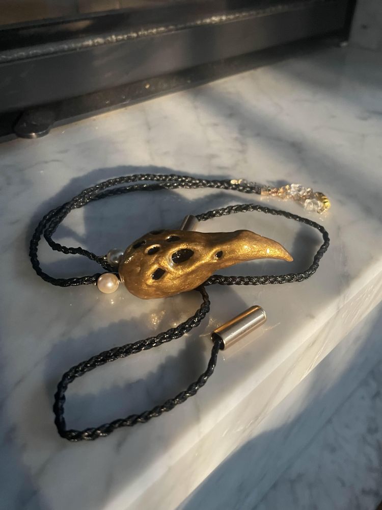 hand made eight eyed teratorn tie, skull made out of clay 