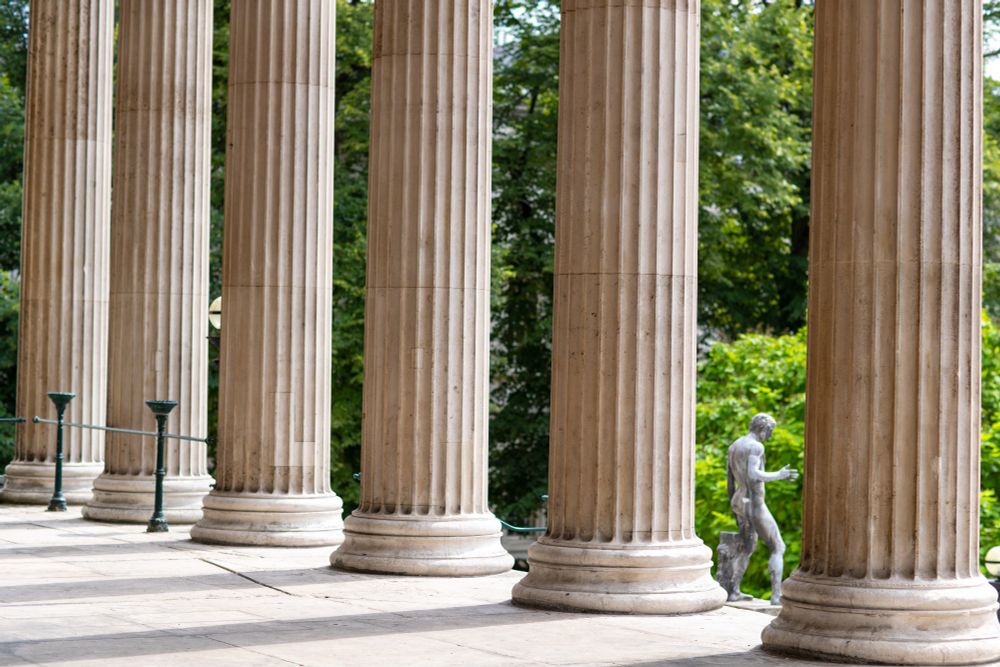 Stone columns with a statue in between.