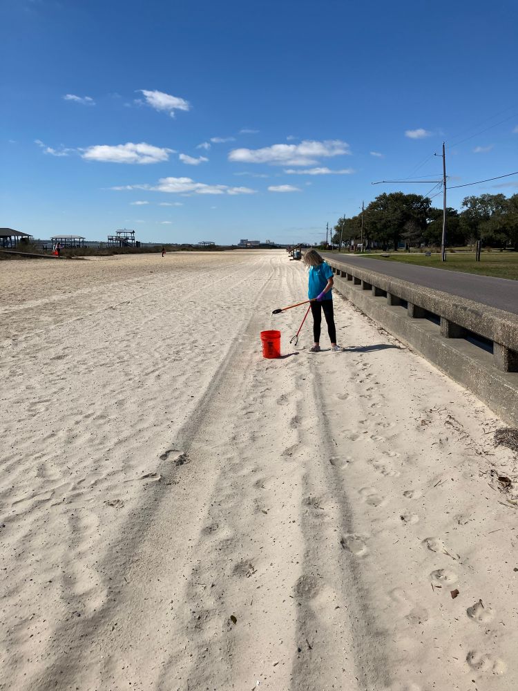 Robin cleaning the beach
