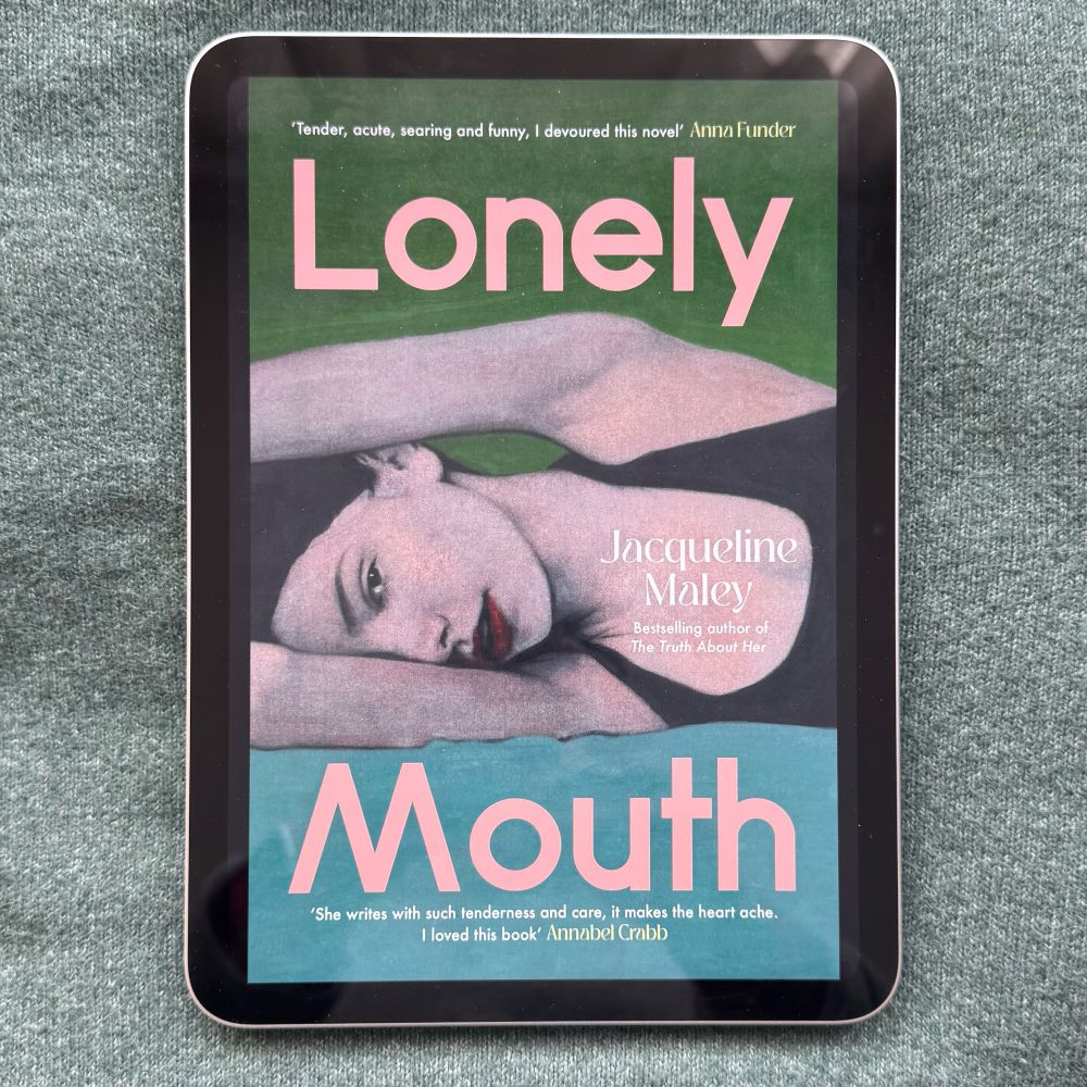 iPad showing book cover “Lonely Mouth” but Jacqueline Maley