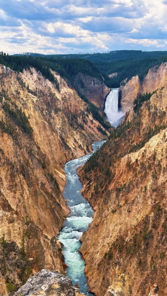 A long distance view of Artist Point’s Upper Falls, from the perspective of the Lower Falls, at Yellowstone National Park 