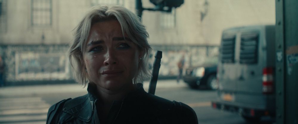 Florence Pugh as Yelena in Thunderbolts*, looking at someone off camera with teary eyes, about to cry