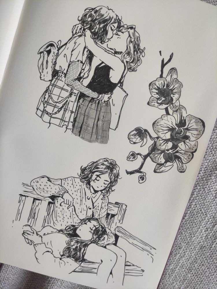Ink drawings on a sketchbook page, studies : two women kissing ; two women on a bench, one is resting her head on the other's lap ; drawing of orchids
