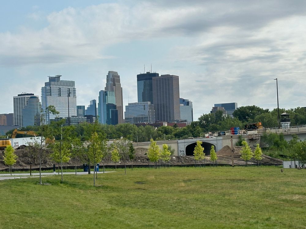City skyline of Minneapolis with construction of a tunnel under the Plymouth bridge.