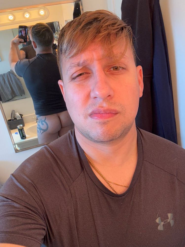 Making a weird face in the bathroom and you can see my booty in the mirror behind me