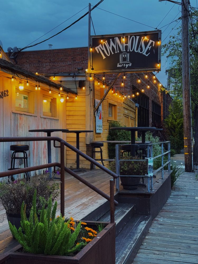 Exterior of townhouse bar and grill at sunset