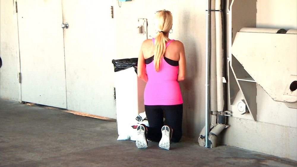 Kim richards religious arc praying next to a trash can on rhobh