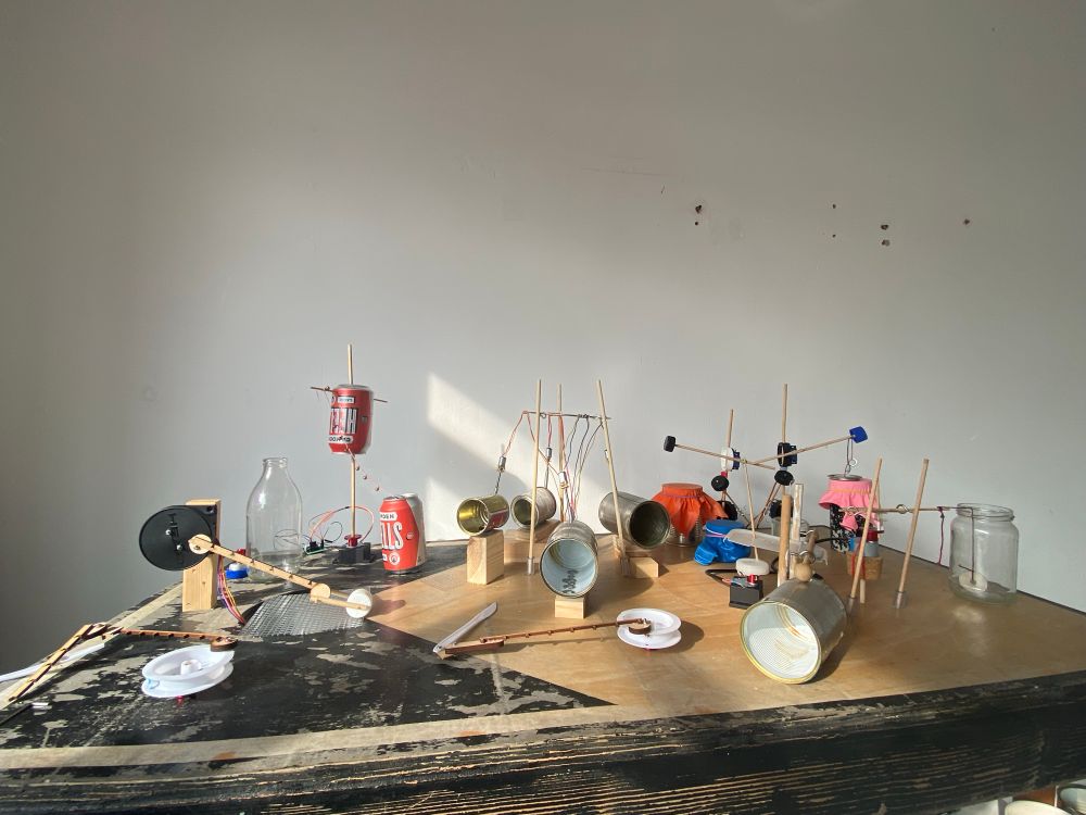 A table top of rubbish attached to motors so it moves and makes sound 