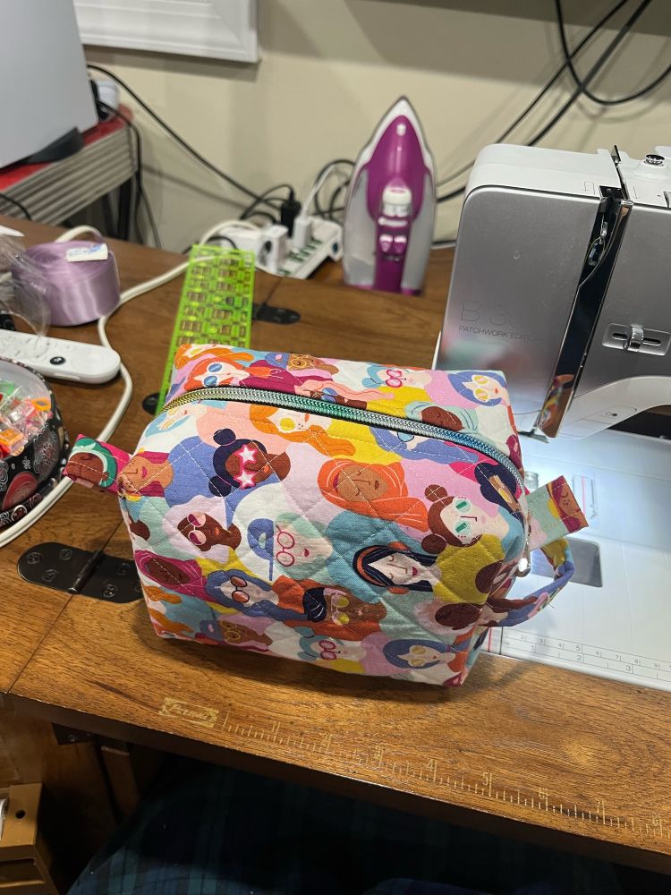 A homemade bag showing a diverse array of women’s faces.