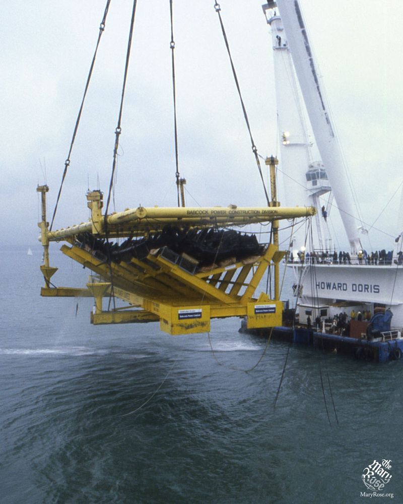 The Mary Rose, suspended from cables above the surface of the Solent 
