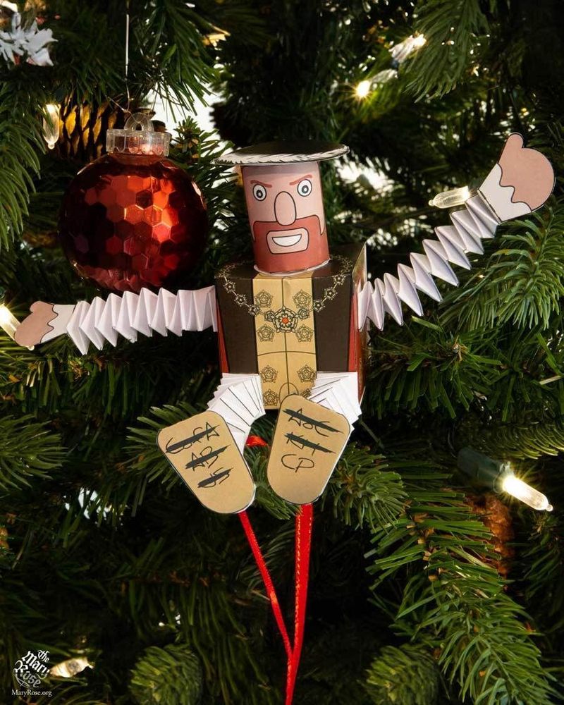 A papercraft model of Henry VIII, sitting in a Christmas Tree