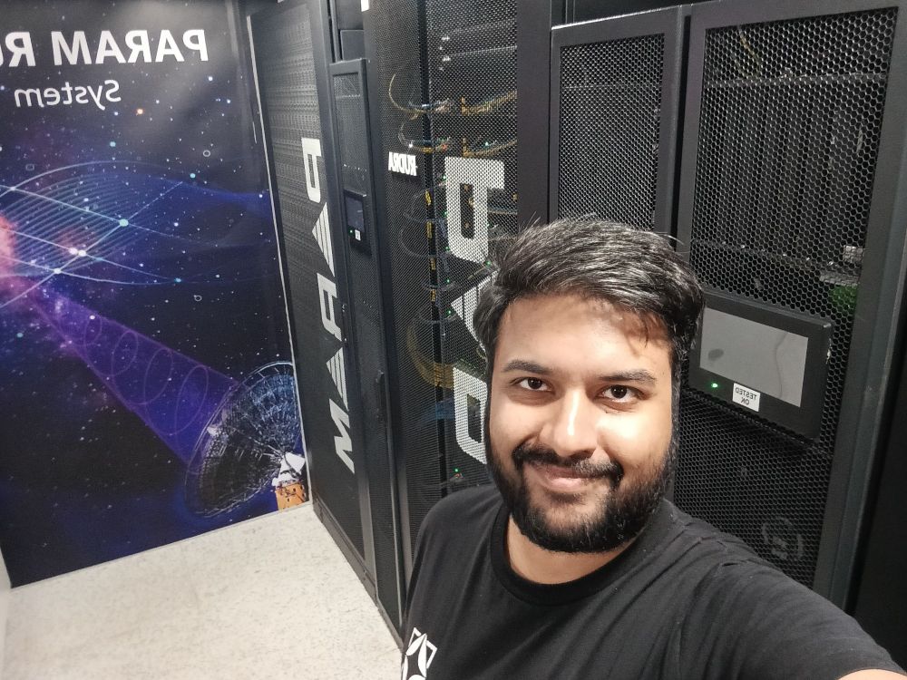 Me, taking a selfie with the supercomputer that forms the backbone of my work.