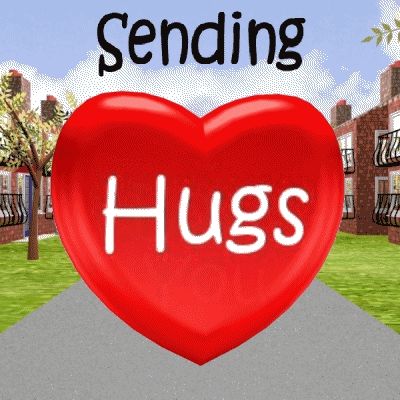 a red heart with the words " sending hugs " on it