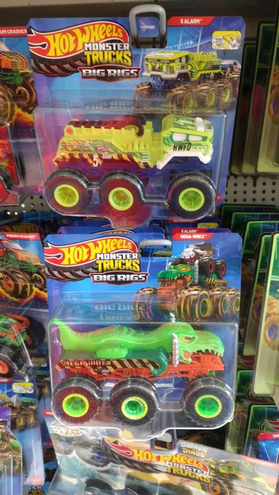 Toy car of six monster truck wheel toting big rig style trucks times two on a shelf in a Topshop.