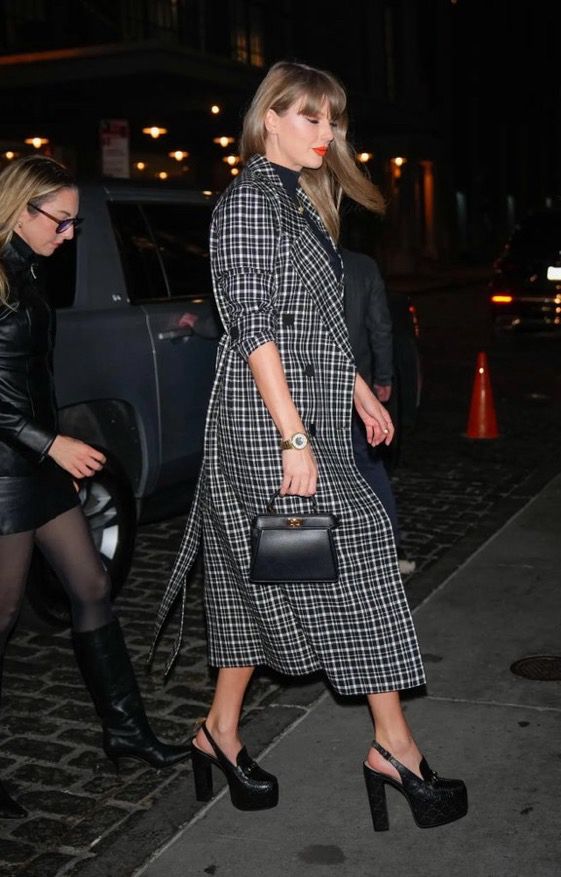 From the side, you can see her coat but not the skirt 