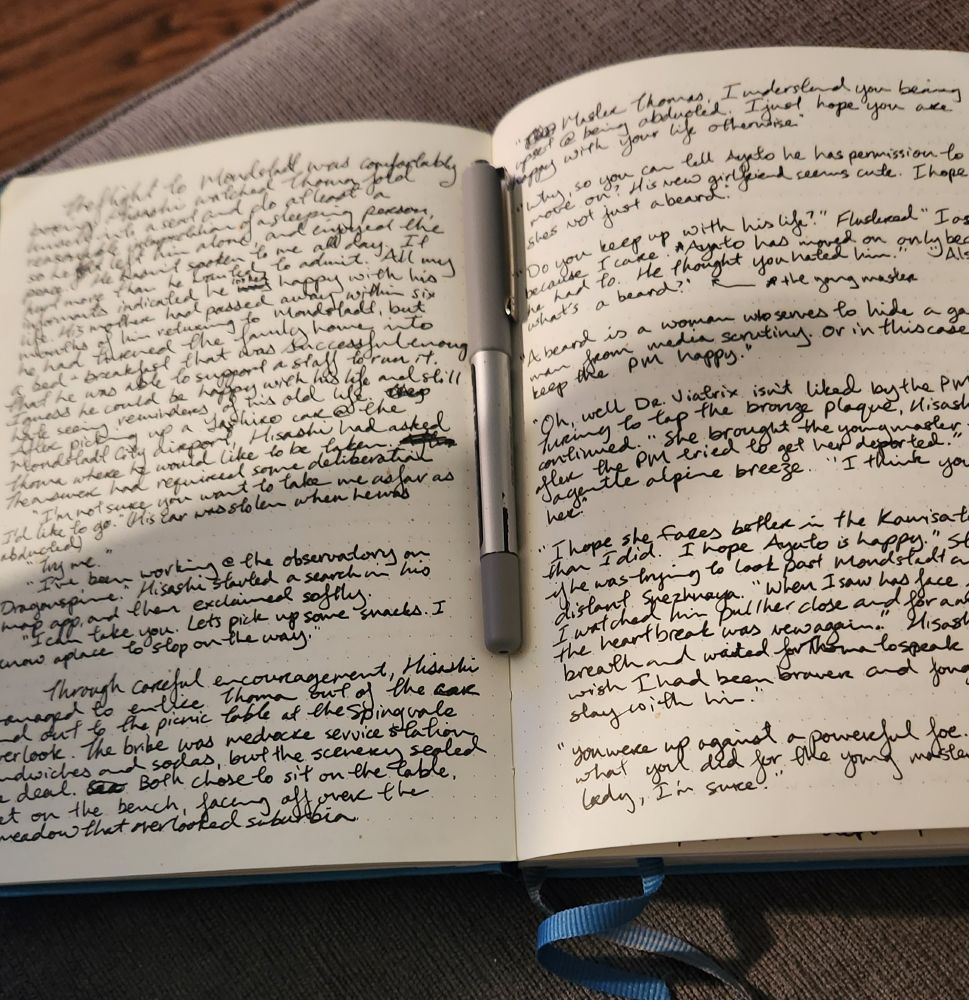 A notebook open to two pages of messy handwriting, that was a first draft of a chapter of the genshin fanfic Relentless Entropy