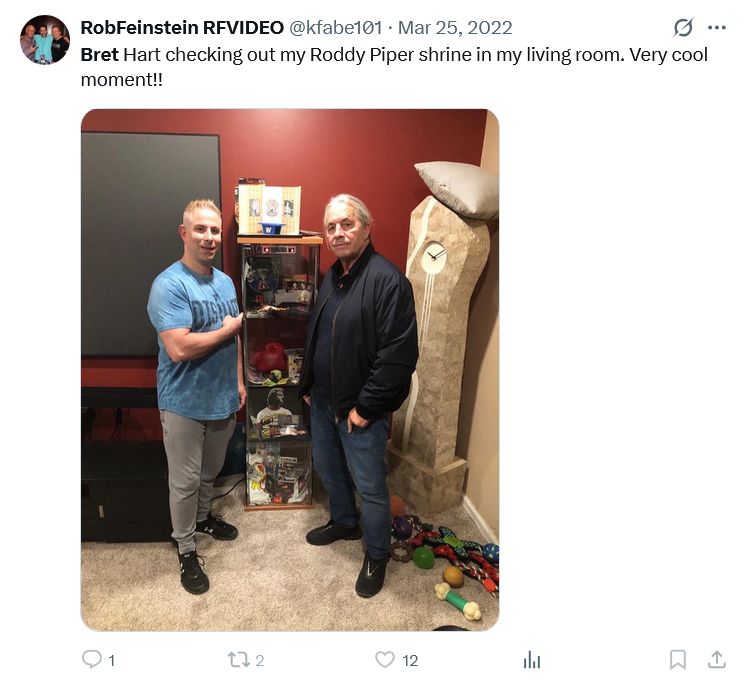 RobFeinstein RFVIDEO
@kfabe101
·
Mar 25, 2022
Bret Hart checking out my Roddy Piper shrine in my living room. Very cool moment!!

A photo of Bret and ROb in his living room, Bret is standing in front of a phallic stone clock with white dripping off it.