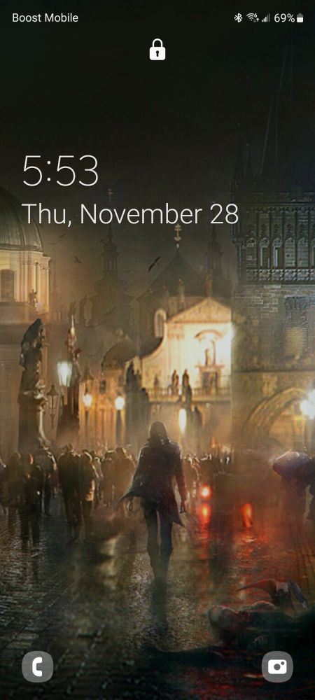 Screenshot of a phone's lock screen. The image depicts art of a dark figure in the center walking through the rain drenched streets of Prague.

The source image is concept art from the game "Vampire: The Masquerade - Bloodhunt".