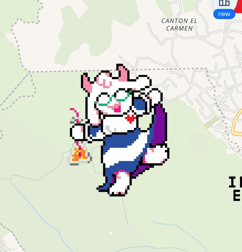 Pixel art of Ralsei from Deltarune wearing a traditional El Salvadoran dress and holding what I'm pretty sure is a bottle of Kolashanpan.