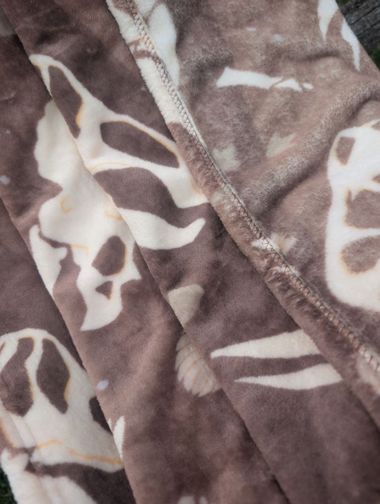 A close up of the fossil blanket, showing off how soft it is