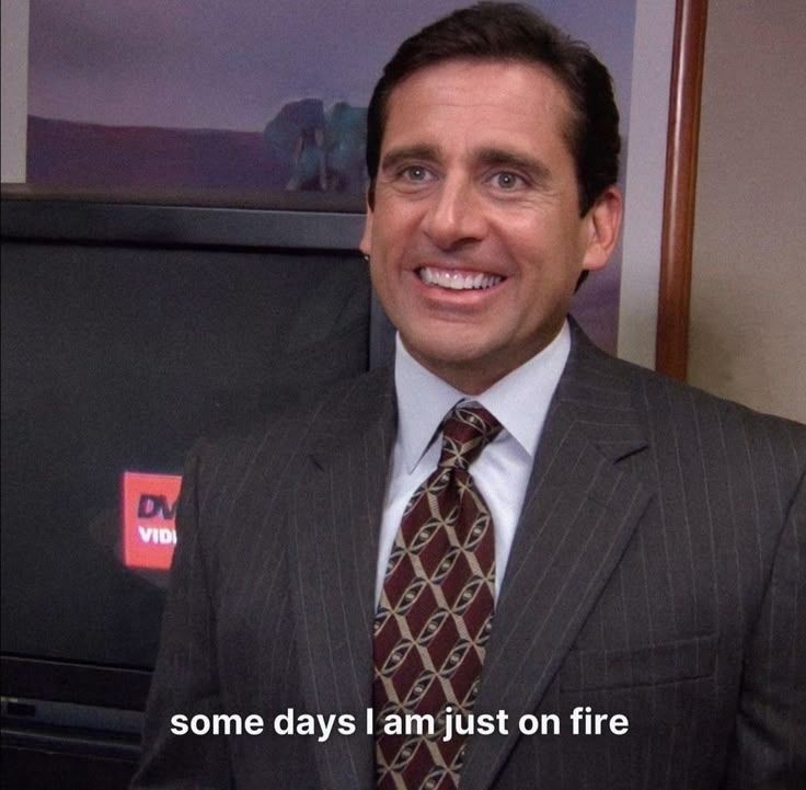 Meme of Michael Scott from The Office. He's wearing a gray pinstripe suit and standing in front of a TV with a grin on his face. 

Quote: Some days I am just on fire.