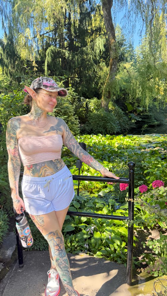 Vaughn wearing costume elf ears while posing for a photo at the Butchart Gardens in Victoria BC