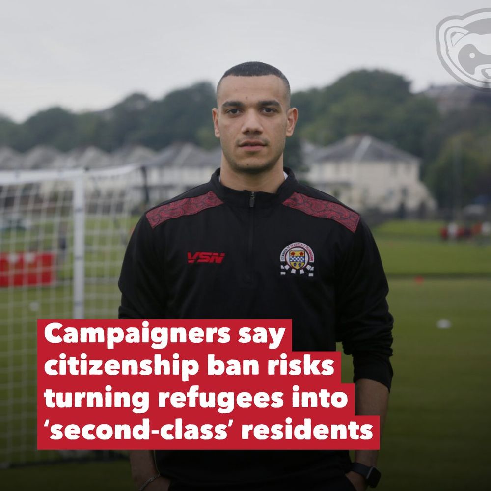 A young man in a black football tracksuit stands on a pitch with houses in the background. Overlaid text says: “Campaigners say citizenship ban risks turning refugees into ‘second-class’ residents,” in bold white and red lettering.