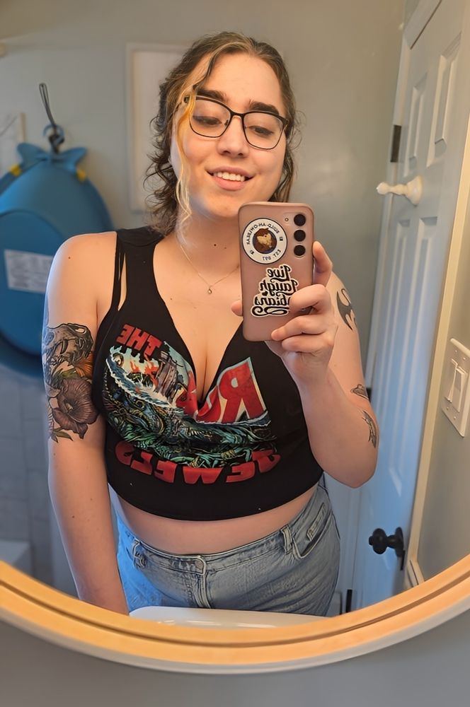 A selfie of me in a crop tank top and jeans