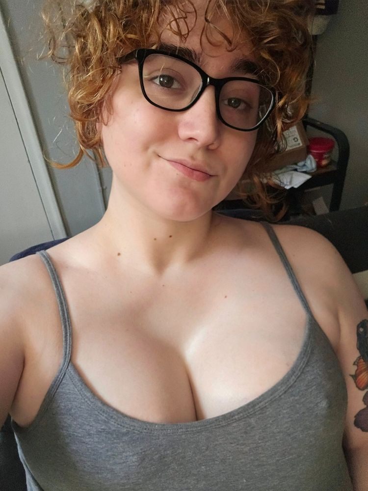 A selfie of me with my hair up in a grey halter top