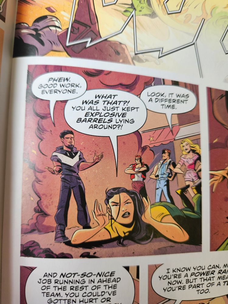 A panel from Rita's Rewind where Zack is saying "Phew. Good work everyone" while Minh is on the ground, outraged, yelling "WHAT WAS THAT?! You all just kept EXPLOSIVE BARRELS lying around?!" as Kat replies "Look, it was a different time."