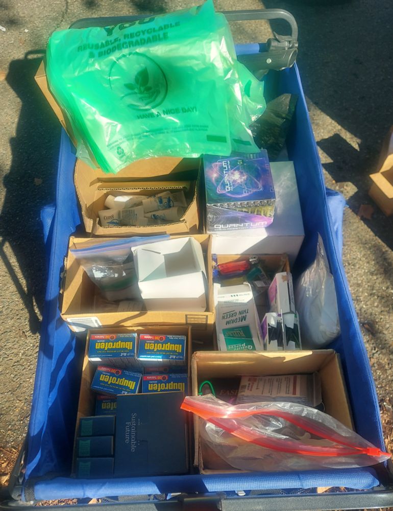 A photo of our cart full of supplies, includinglighters, rolling papers, tissue boxes, ibuprofen, and lotion.