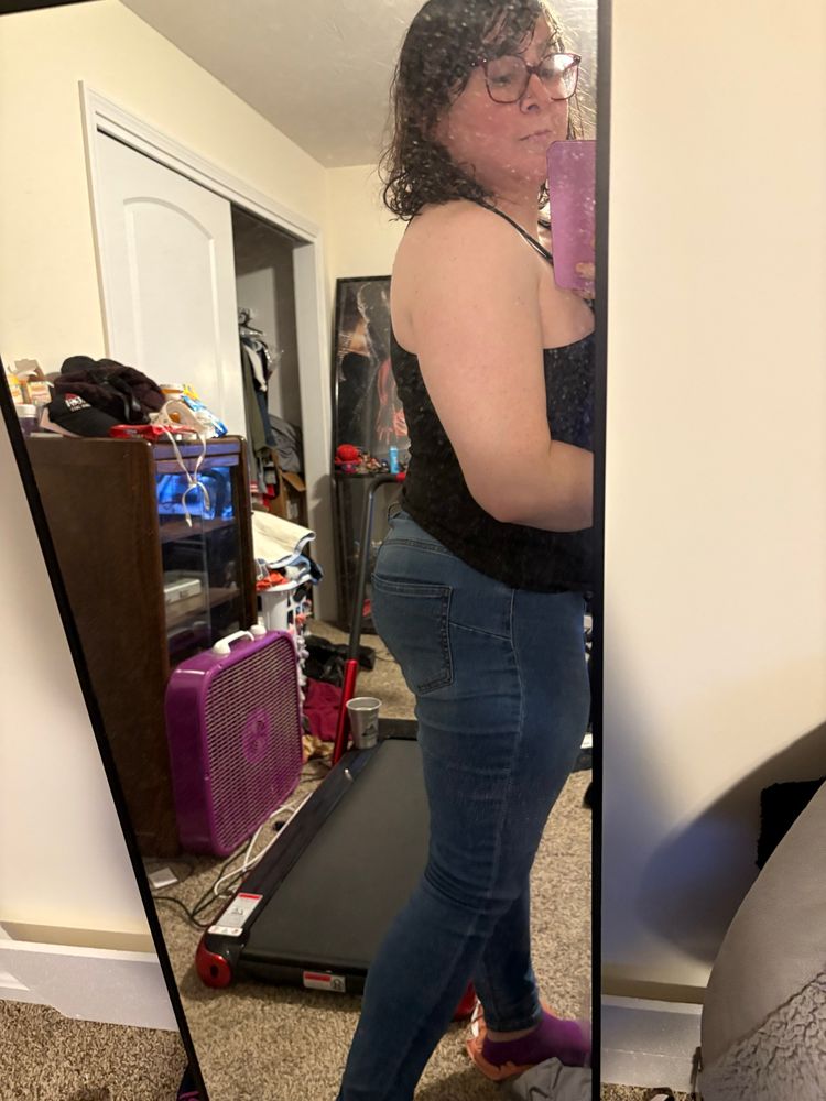 Zoe Parker in jeans and a black tank top except from the side, showing off her big butt.