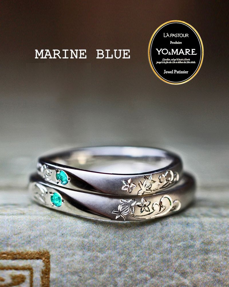 鮮やかなマリンブルーの超希少石・パライバトルマリンをセットした結婚指輪に、波とウミガメとプルメリアを手彫りで描いたオーダーメイド作品
