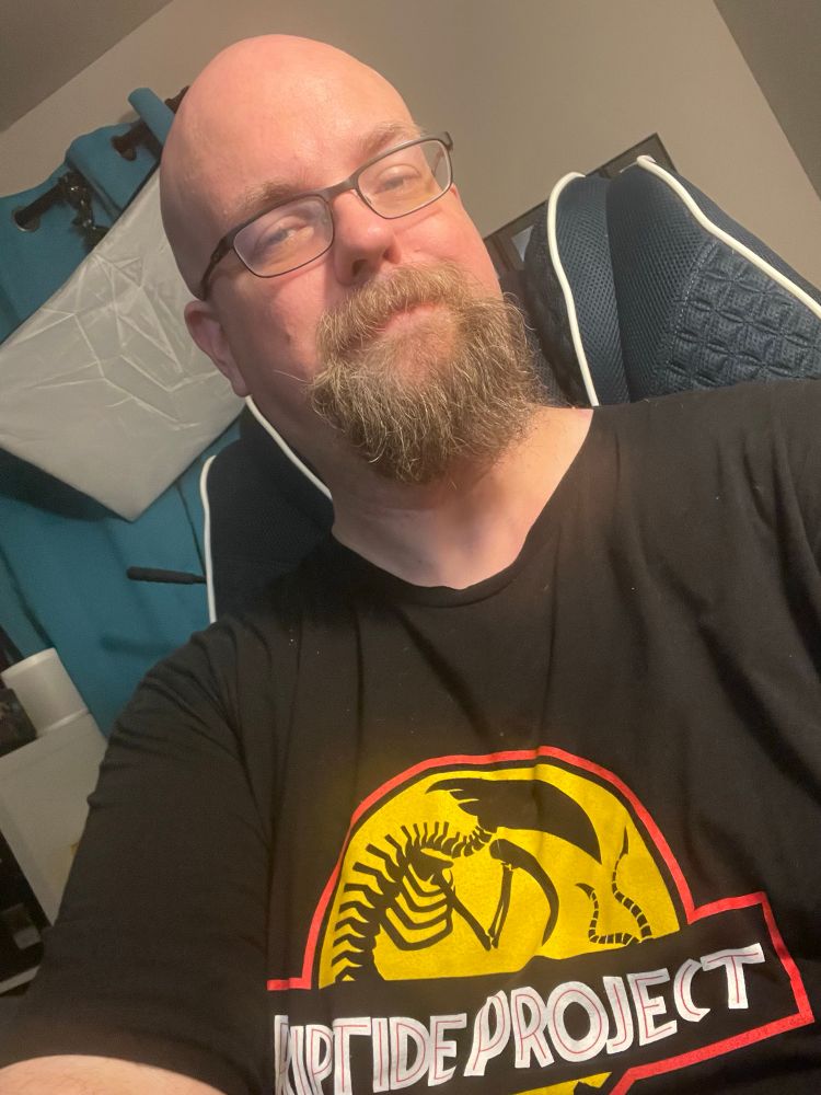 My goofy self wearing a shirt with Riptide Project on it with a sliver in the style of a Jurassic Park logo. 