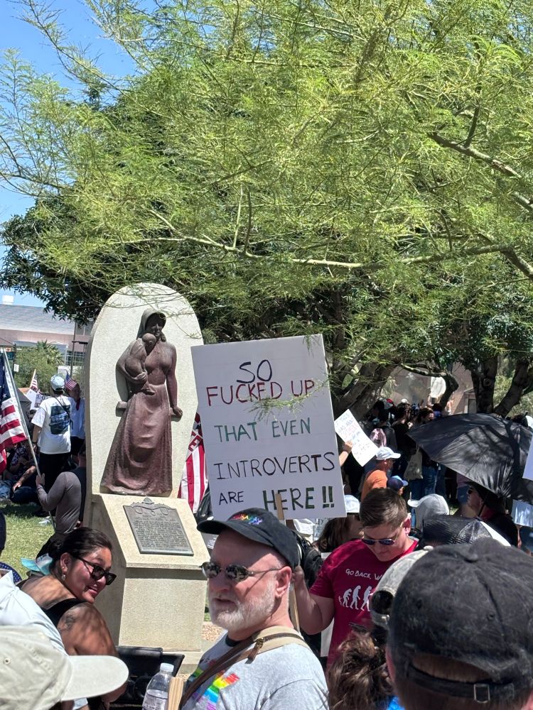 The sign says, so fucked up that even introverts are here!