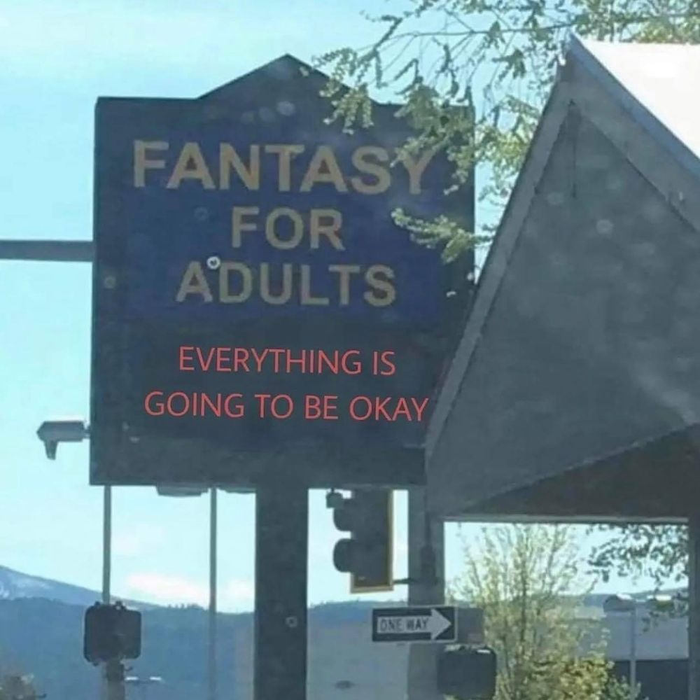 Sign : FANTASY FOR ADULTS

lower sign : 'everything is going to be okay'