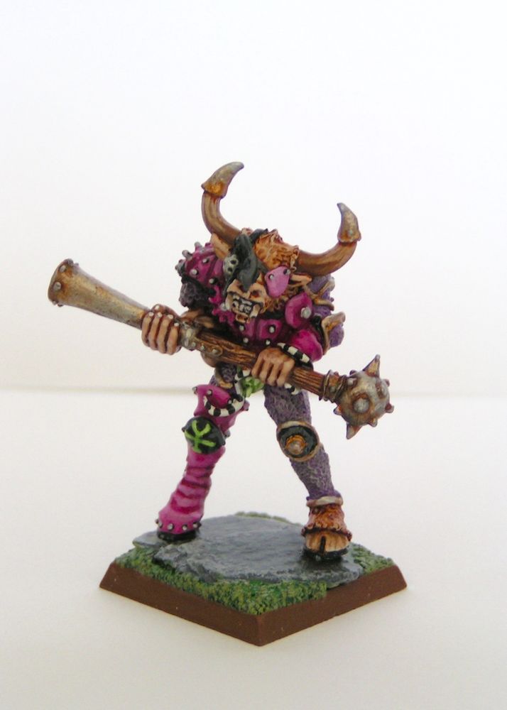 A champion of Slaanesh with a miniature head of a greater demon of Slaanesh.