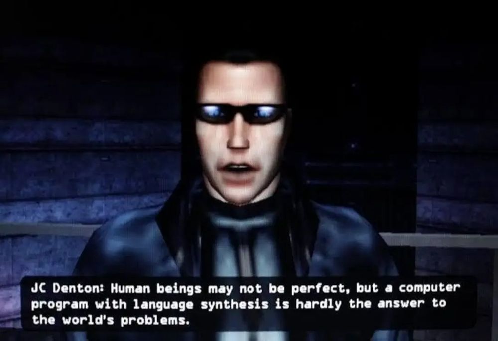 A screenshot of JC Denton, the main protagonist of Deus Ex (2000).

He says: "human beings may not be perfect, but A computer program with language synthesis is hardly the answer to the world's problems."