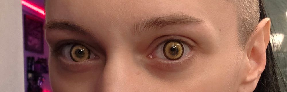 C0ffinCunt wearing yellow contacts.