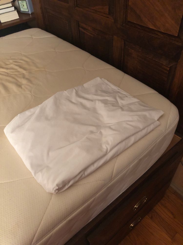 Fitted sheet folded into a perfect rectangle,