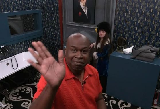 Will in the HoH bathroom waving to the camera