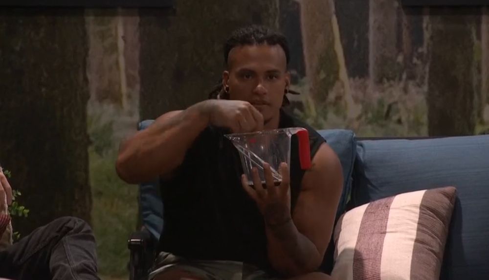Keanu holding his mixing bowl at the bottom and miming eating cereal out of it.